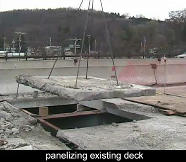 the existing deck has been saw cut into panels and removed